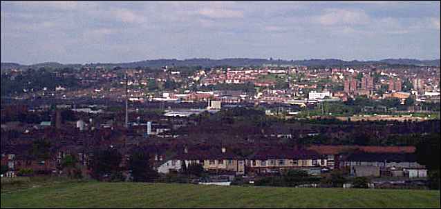 In the distance the Lyme Valley around Newcastle-under-Lyme, in the centre is Stoke and to the centre right are flats near Honeywall