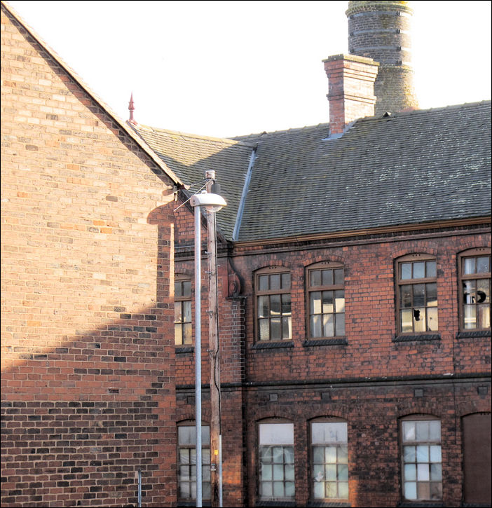 the closeness of the houses, works and bottle kiln