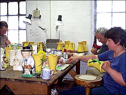 Hand painting the biscuit ware