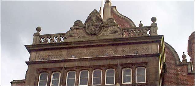 a relief coat of arms on the upper faade, 