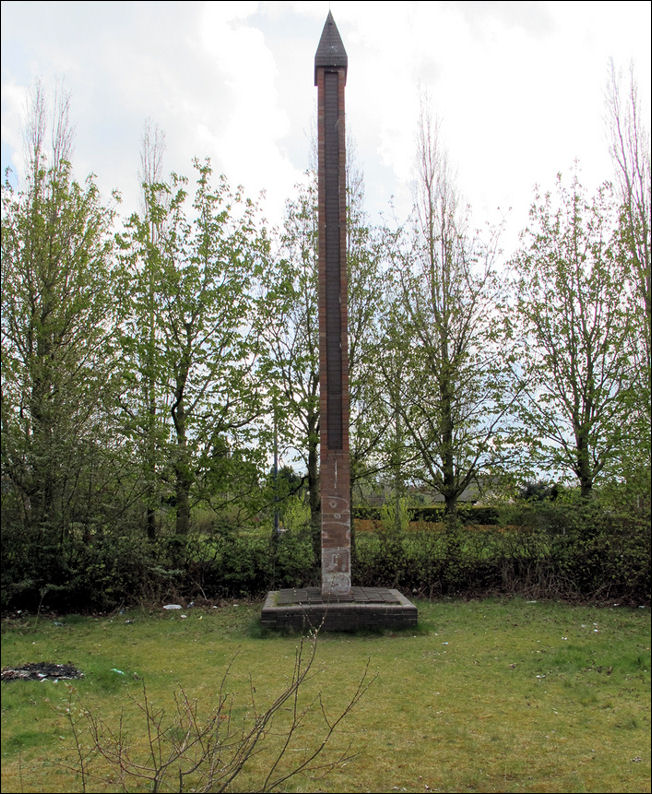 the brick obelisk at the start of the historic gardens zone